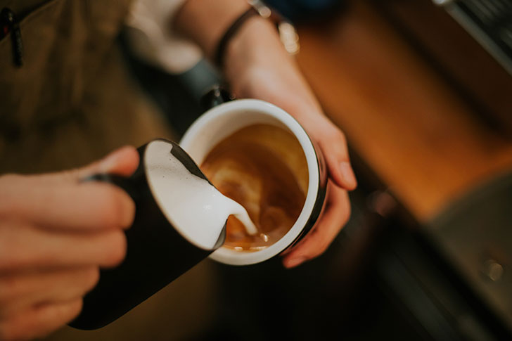 Barista making coffee